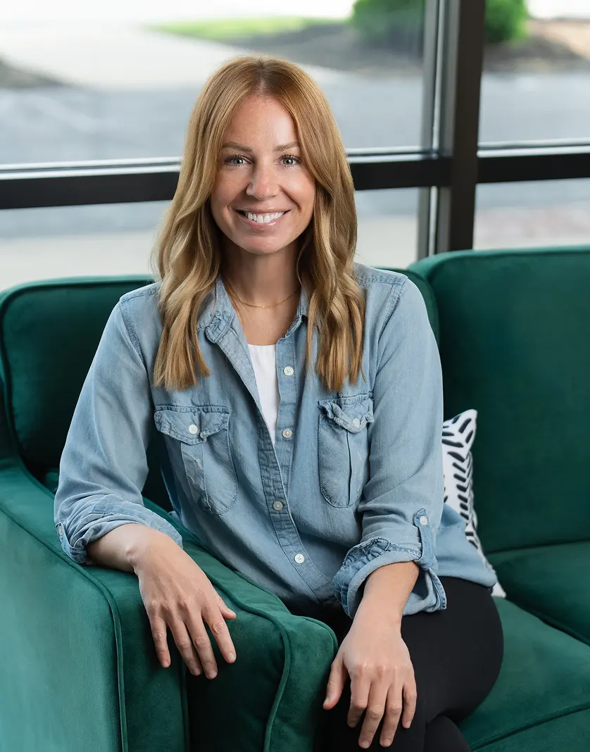 SD Capital team member smiling in office lounge