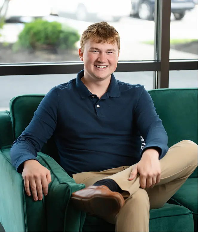 SD Capital team member Collin Berryman seated in office lounge