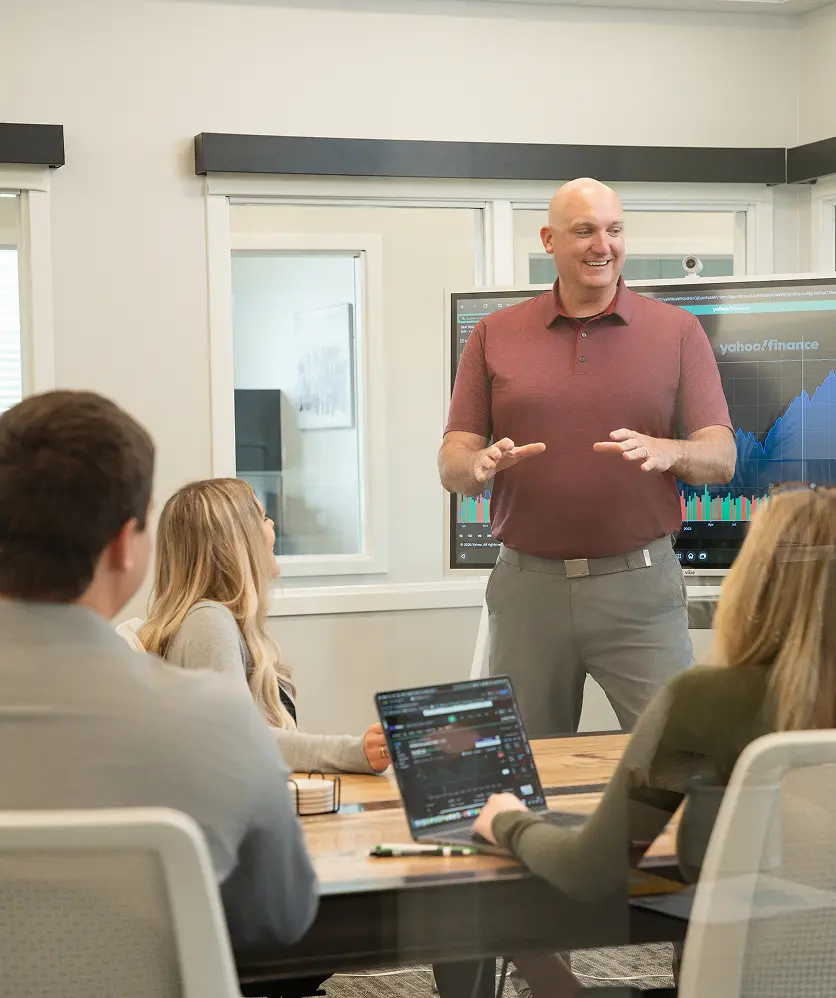 SD Capital co-founder leading a financial planning meeting in office