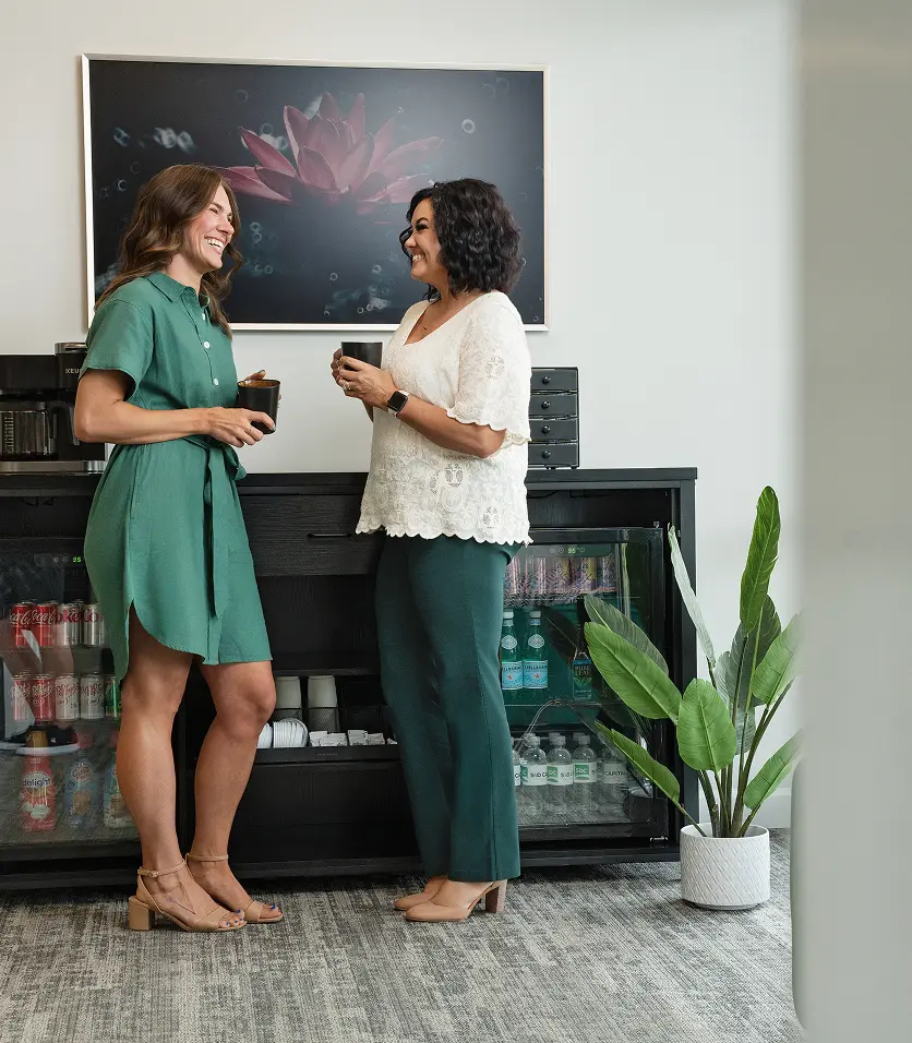 SD Capital team members chatting in office break area