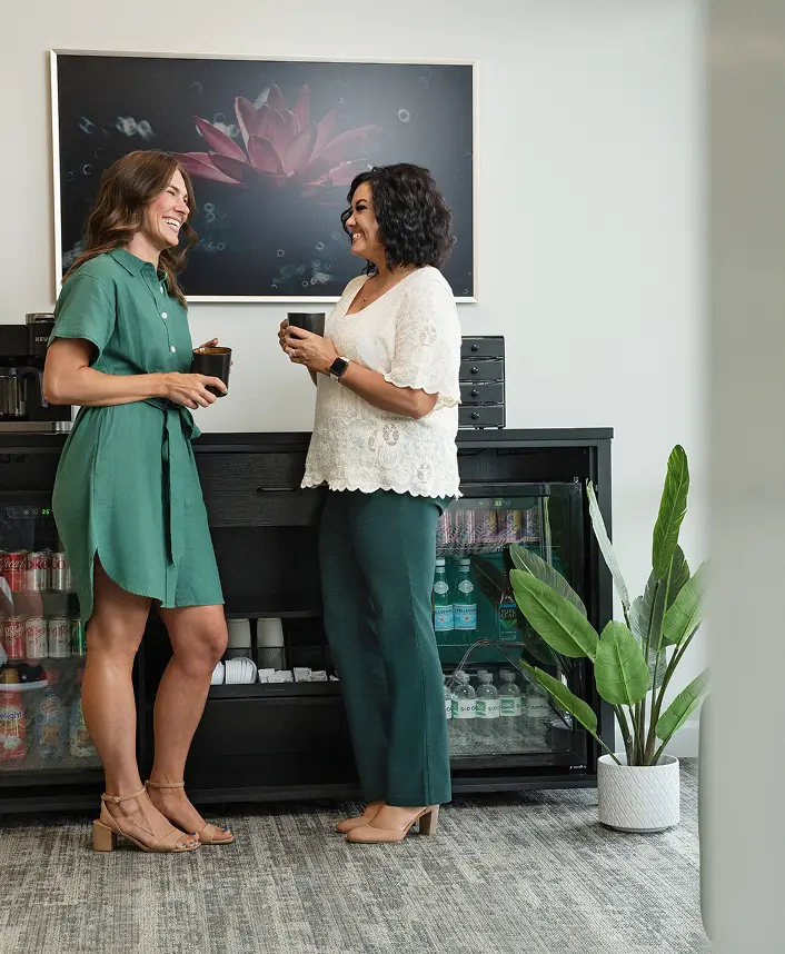 SD Capital team members chatting in office break area