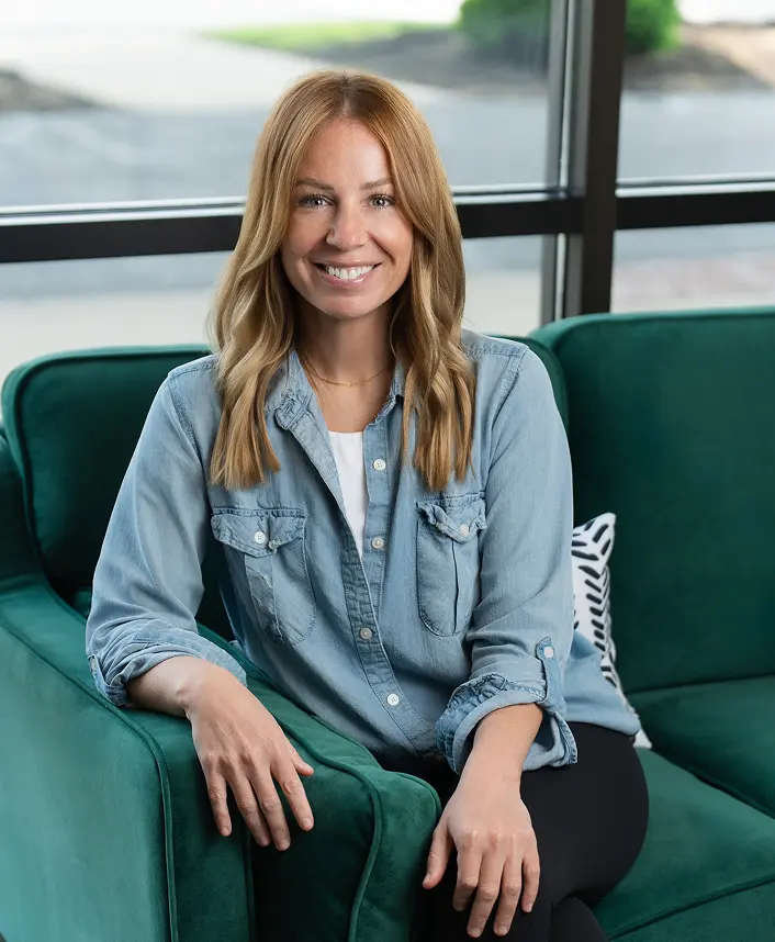 SD Capital team member smiling in office lounge